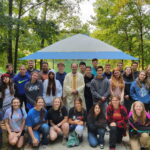 Catholic college prep high school students in Mason working together on a team project outdoors at Royalmont Academy.
