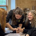 Students working together in a small Catholic school classroom at Royalmont Academy